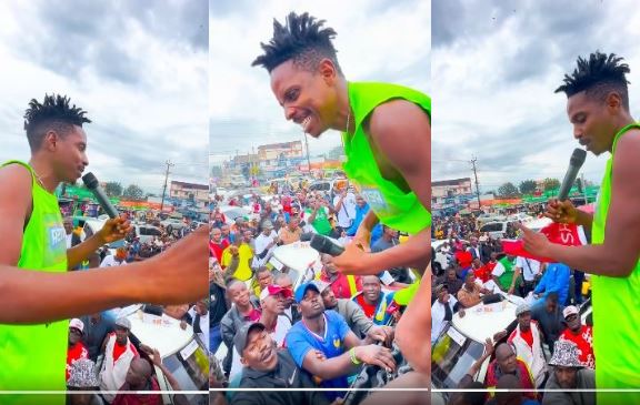 Eric Omondi flanked by a sizeable crowd in Kisumu as his walk from Nairobi to Busia continues. PHOTO/A screengrab image by K24 Digital from https://www.facebook.com/profile.php?id=100044317755329