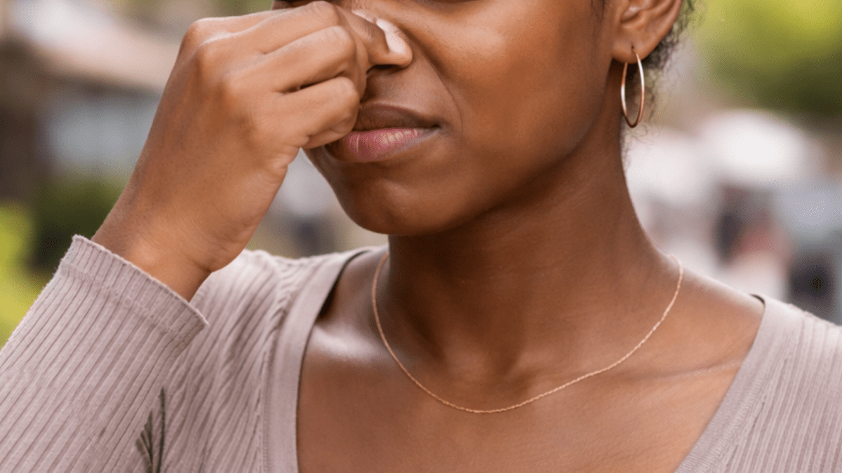 A cropped image pf someone covering their nose. PHOTO/Photo generated by AI