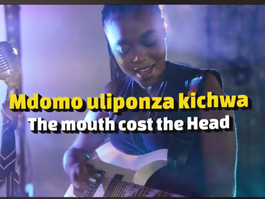 Screengrab by K24 Digital of a lady playing guitar. PHOTO/https://www.youtube.com/watch?v=YD-KRh5uzGo