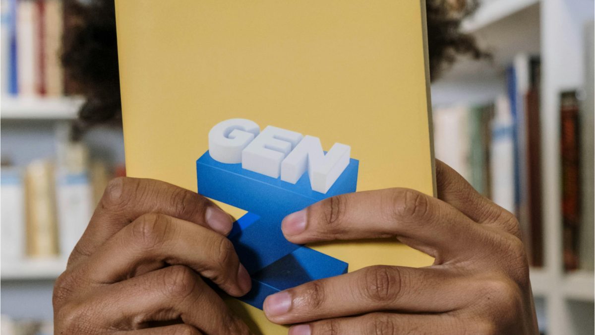Close-up Photo of Yellow Book held by a Person