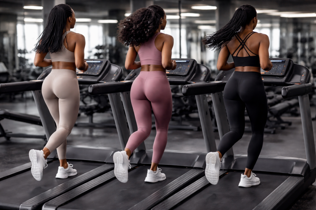 Three women running on a treadmill. PHOTO/AI