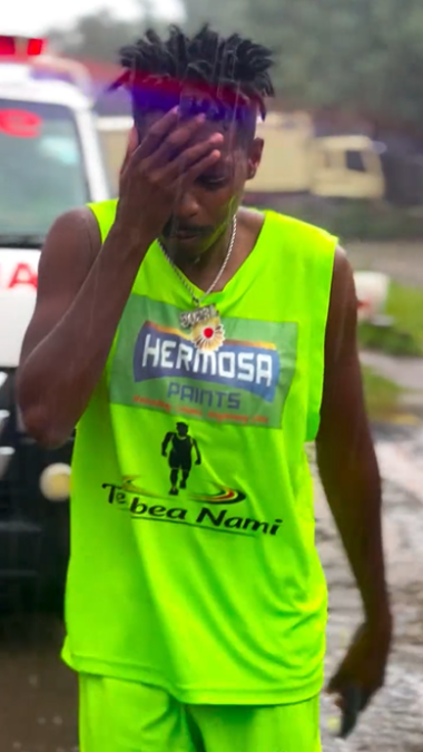 Eric Omondi braves heavy rain in Gilgil, Nakuru County, during his trek to Busia. PHOTO/@ericomondi/Instagram