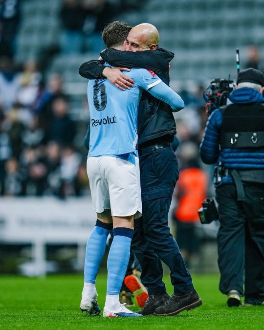 Pep Gurdiola hugs John Stones after Newcastle United's FA Cup tie. PHOTO/https://web.facebook.com/mancity