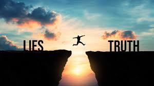 A silhouette of a person leaps across a cliff gap at sunset, symbolically jumping from “LIES” to “TRUTH.” PHOTO/Pexels