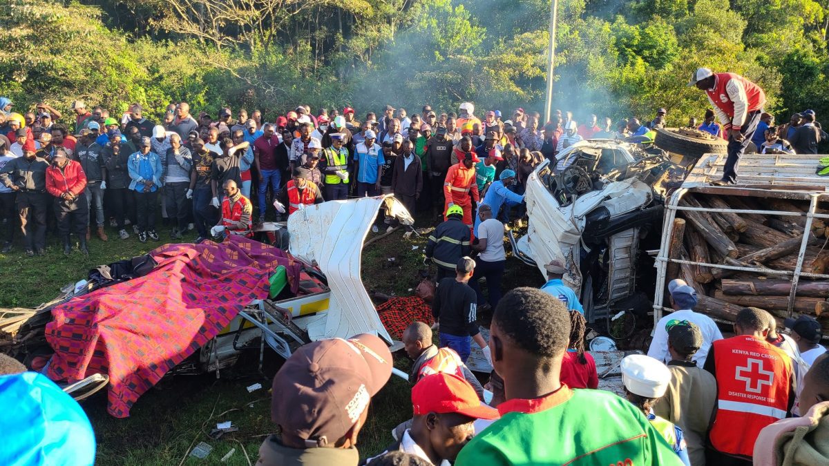 Onlookers gather as emergency crews try to extract passengers trapped in the crushed matatu. PHOTO/https://www.facebook.com/mwaurarob