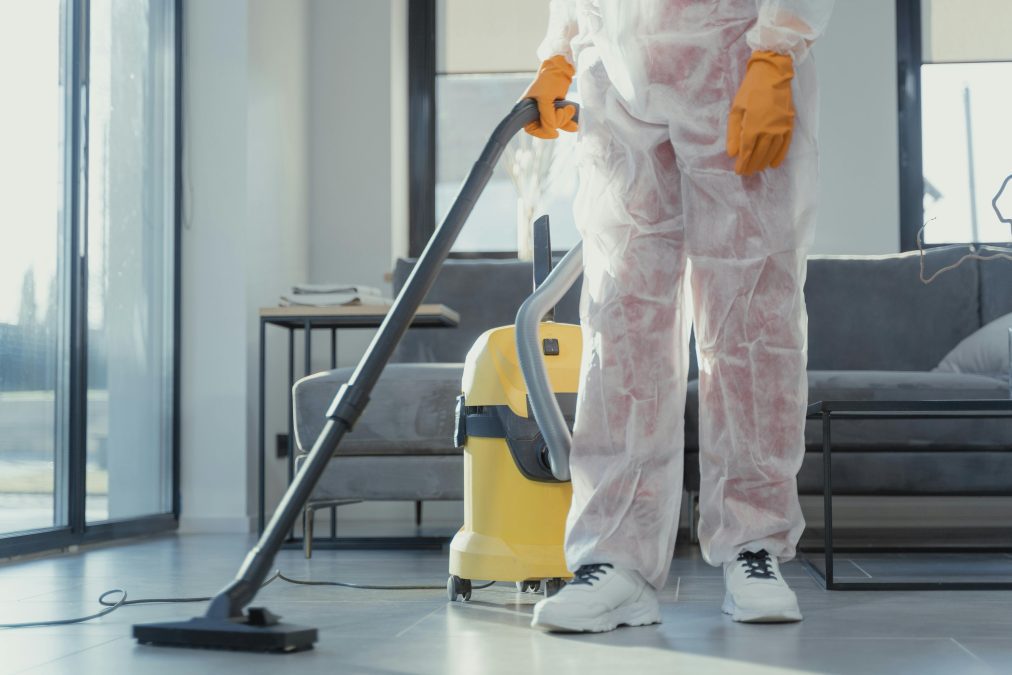 Someone using a vaccum cleaner. PHOTO/Pexels
