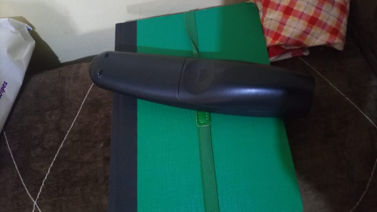 A television remote control placed on top of a green notebook on a notebook inside a house. PHOTO/David Nthua