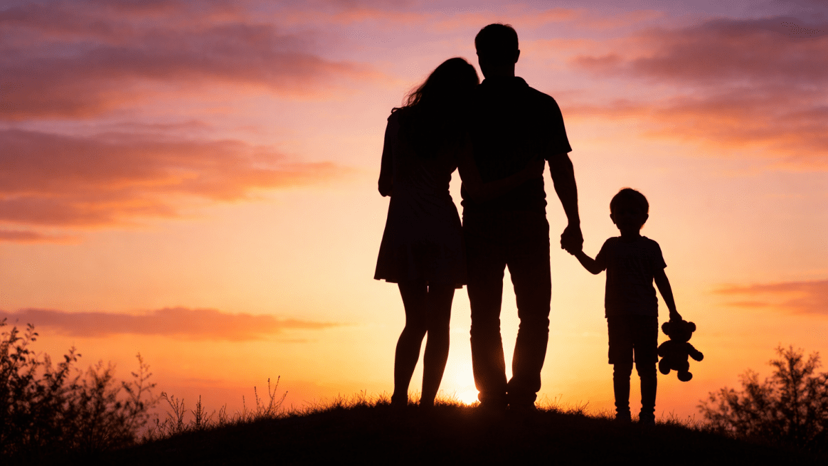 Sunset silhouettes of family love