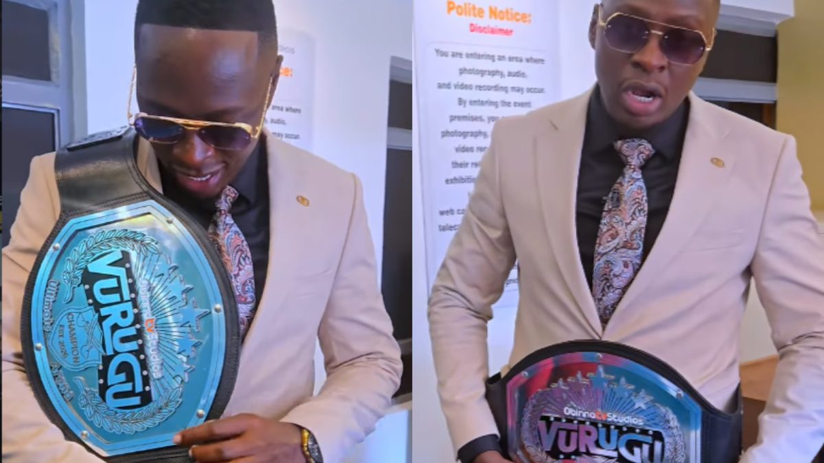 Oga Obinna holding Vurugu's belt. PHOTO/@ogaobinna/Instagram