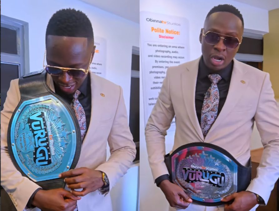 Oga Obinna holding Vurugu's belt. PHOTO/@ogaobinna/Instagram