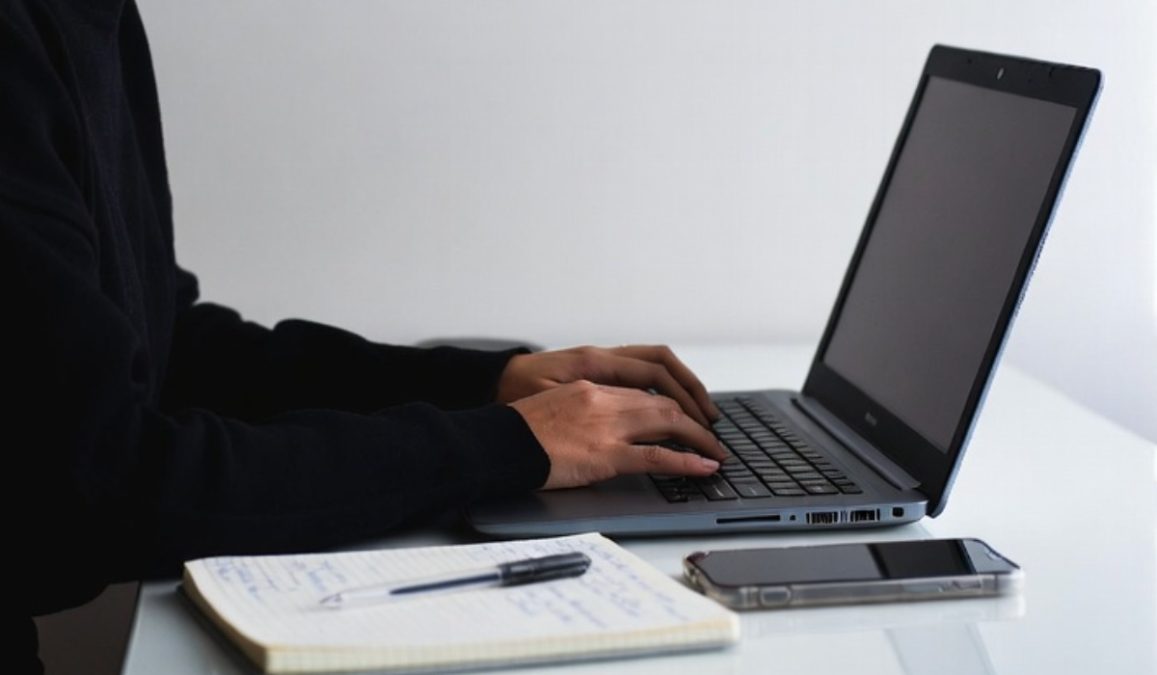 A person using a laptop. PHOTO/AI