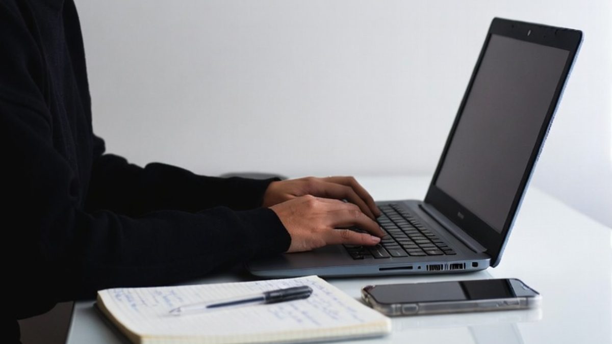A person using a laptop. PHOTO/AI