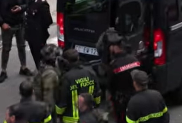 Bank robbers hold 25 people hostage then vanish through tunnel