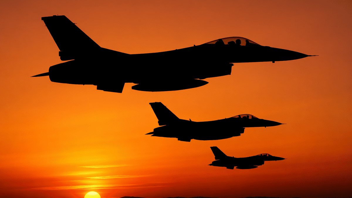 Fighter jets at sunset silhouette. PHOTO/AI