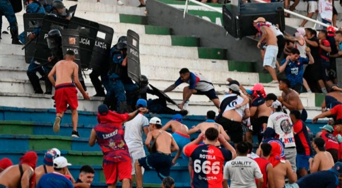Violent clash between police and fans force match abandonment