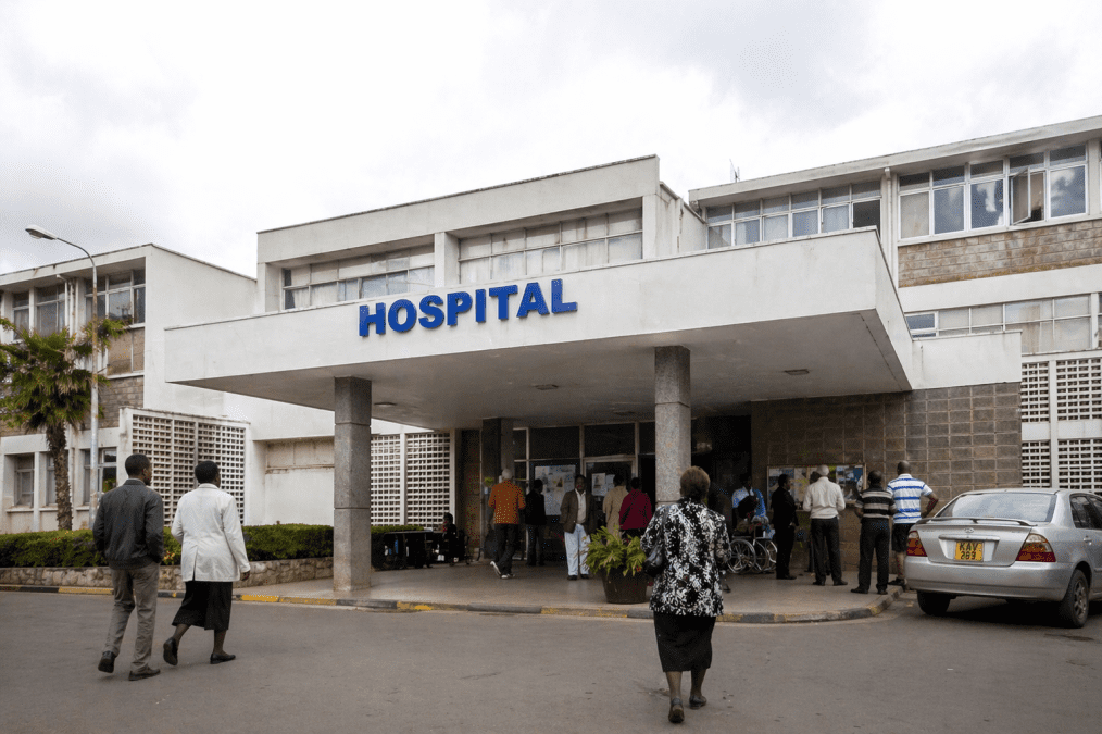 ealistic exterior image of a hospital entrance with patients and visitors arriving. PHOTO/Photo generated by AI