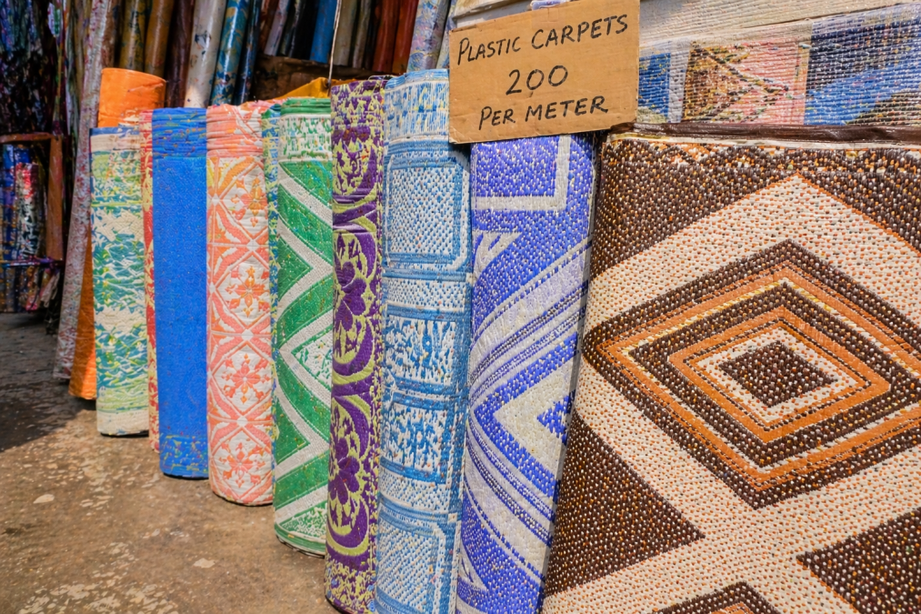 Colourful plastic foldable carpets displayed for sale. PHOTO/Photo generated by AI