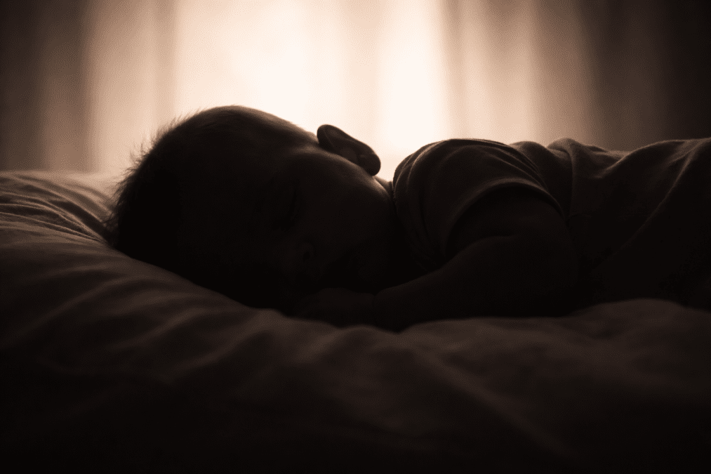 A kid sleeping in bed. PHOTO/Photo generated by AI