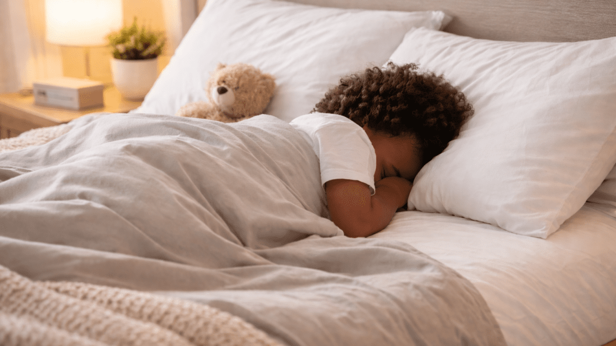 Child sleeping peacefully in a neat bed with face hidden in a cosy bedroom. PHOTO/Photo generated by AI