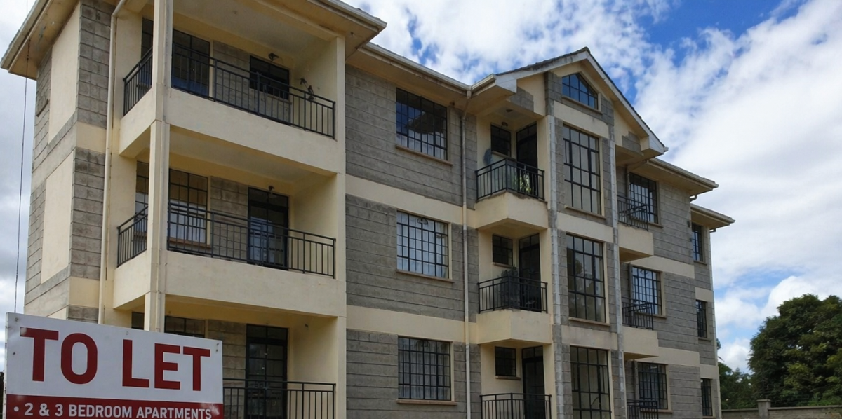 Modern apartment building with balconies and a to let sign outside in a landscaped compound. PHOTO/Photo generated by AI