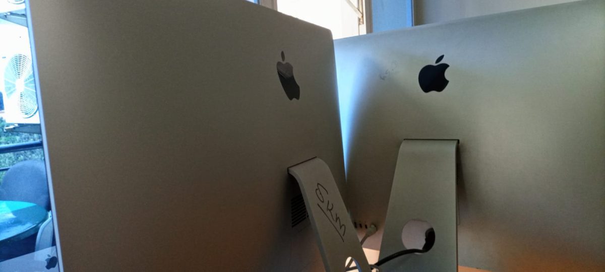 Two iMacs placed on a office desk inside one of the departmental rooms at Mediamax Network Limited. PHOTO/David Nthua
