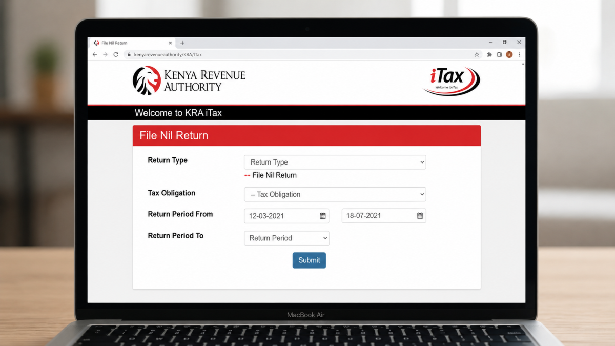 A widescreen image of a MacBook Air displaying the Kenya Revenue Authority iTax portal for filing NIL returns, placed on a wooden table with a blurred indoor background. PHOTO/Photo generated by AI
