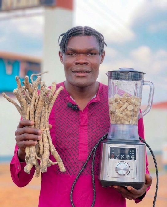 Gen Z Goliath holding Mukombero and a juice blender. PHOTO/https://web.facebook.com/profile.php?id=61565171336413