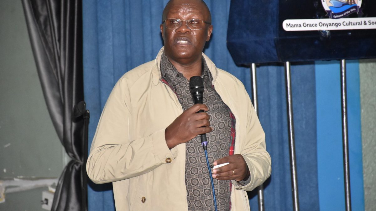 Eliud Owalo speaks during the requiem mass of football legend Allan Thigo at Mama Grace Onyango Social Hall in Kisumu. PHOTO/Viola Kosome