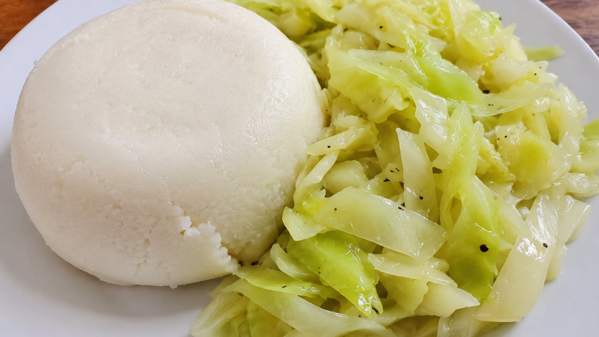 A plate of ugali with boiled cabbage