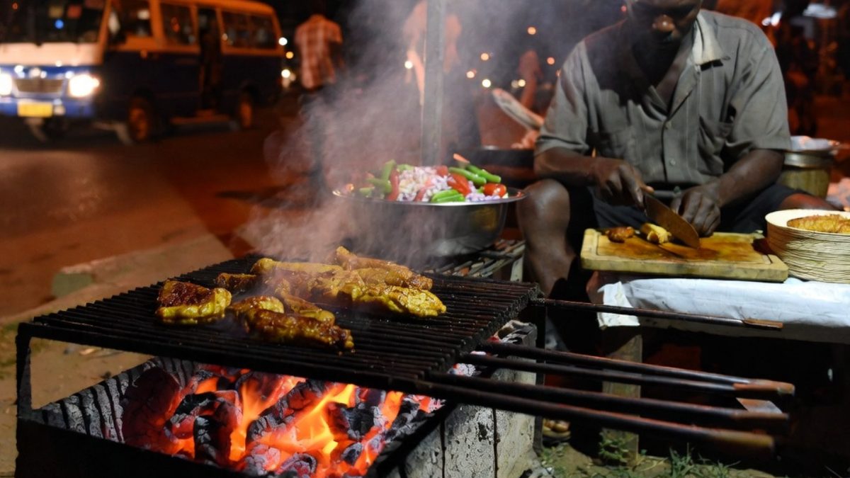 A man selling food by the road side. PHOTO/AI