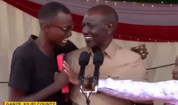 President William Ruto with the young man after he made it to the podium during a Thanksgiving service in Ganze, Kilifi County, on Sunday, May 24, 2026. PHOTO/Screengrab by K24 Digital from @WilliamsRuto on X