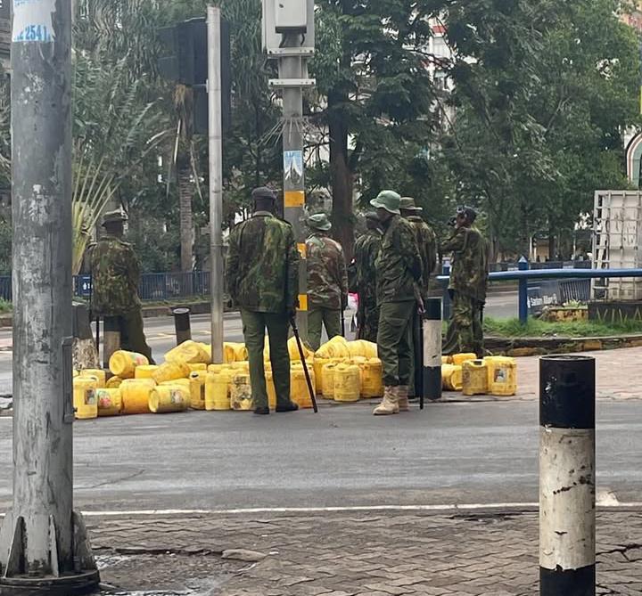 Police confiscating Eric Omondi's Jerry cans. PHOTO/@ericomondi/Instagram
