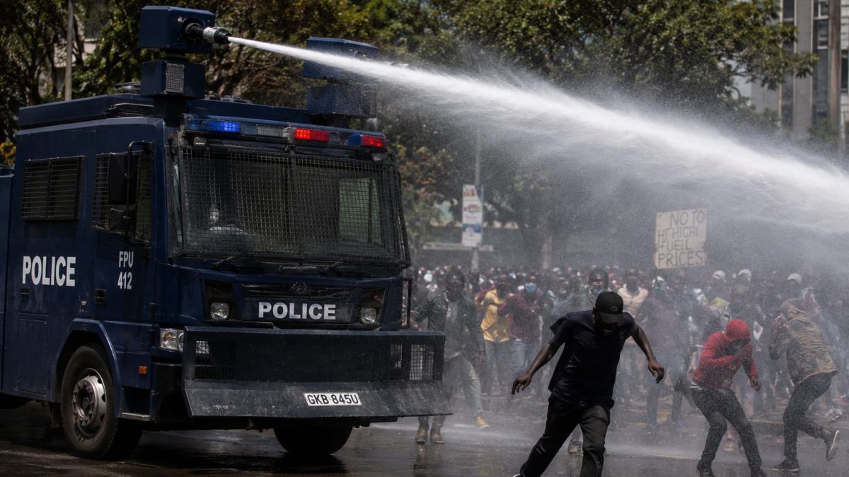 Water canon spraying protesters with water. PHOTO/Photo generated by AI