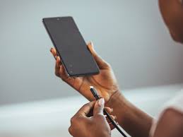 Someone is handling a charging port with care. PHOTO/Gemini