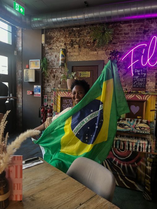 Nana with a Brazilian flag. PHOTO/https://www.facebook.com/NanaOwiti
