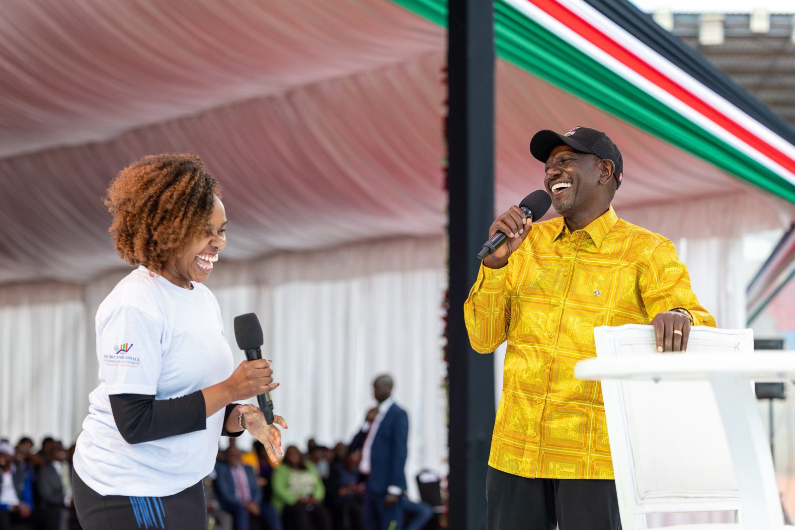 Woman warms crowd after requesting a hug from Ruto