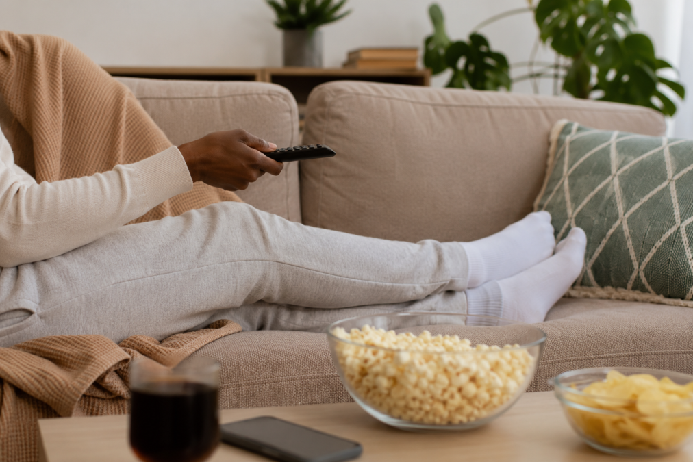 A person relaxing indoors watching.