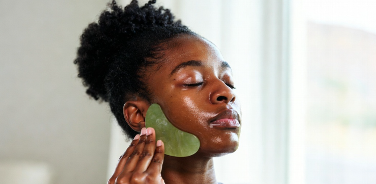 A woman performing her skincare routine.