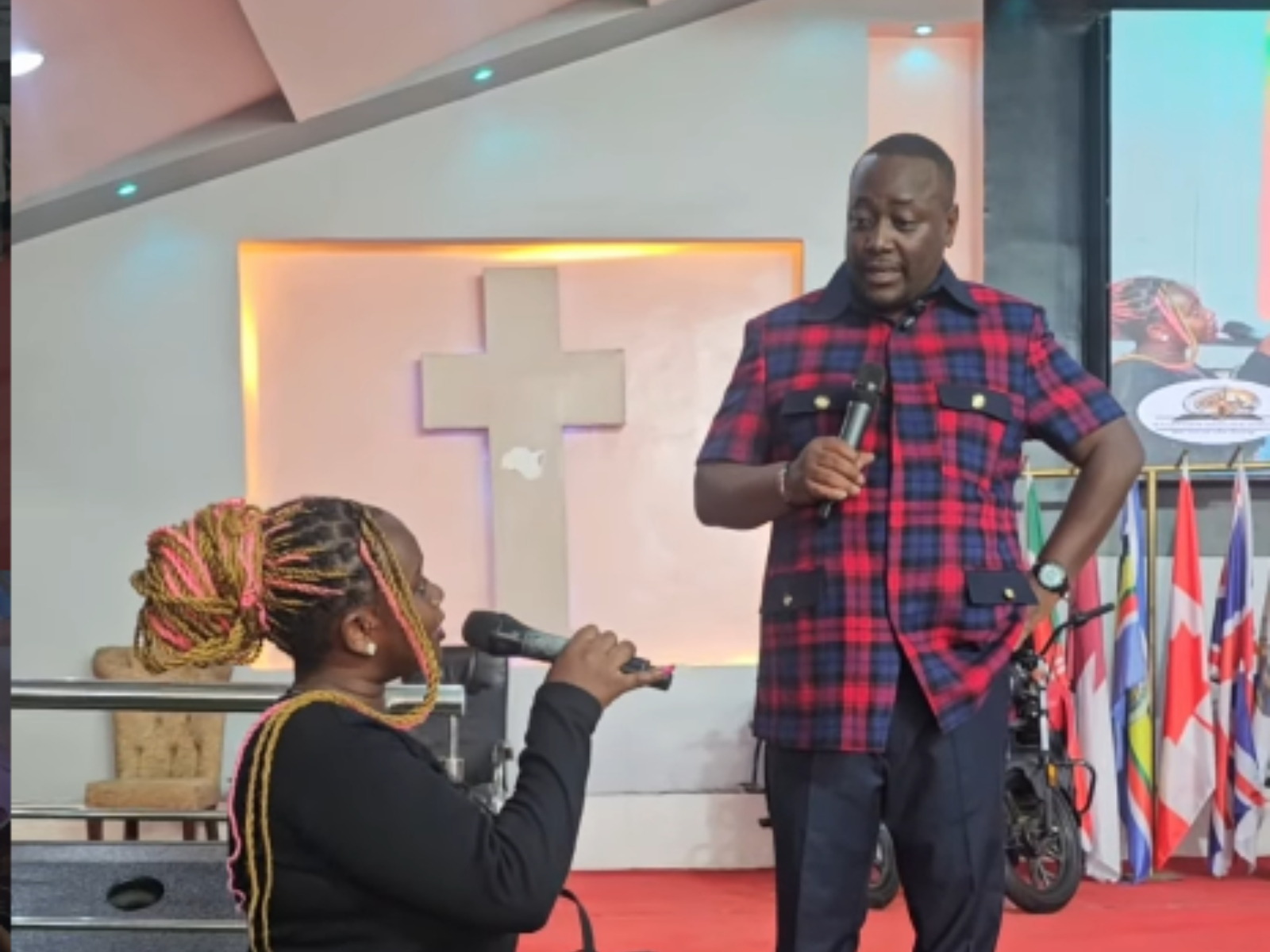 Victor Kanyari with Marion Naipei during church service. PHOTO/@prophet_kanyari/Instagram
