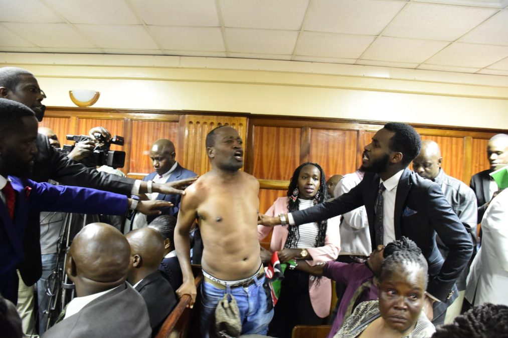 Activist Julius Kamau as he is being calmed down when chaos erupted before Judge Alexander Muteti on Tuesday, July 14, 2026.PHOTO/Zipporah Ngwatu