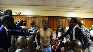 Activist removes shirt, disrupts court proceedings over 3 missing Kenyans