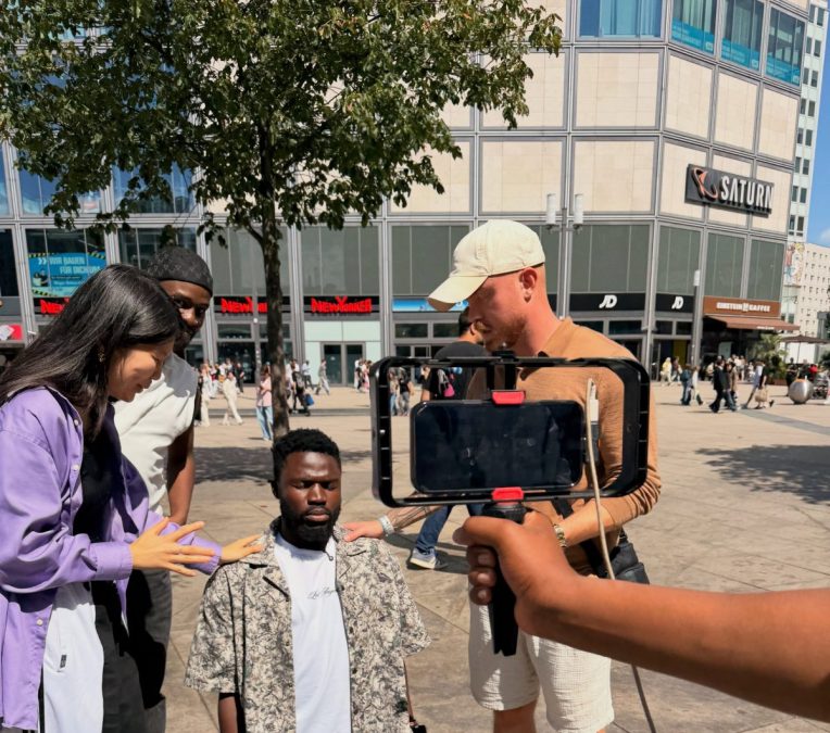 Asian preachers pray for Vindee after a meetup in Germany. PHOTO/@Vindee/Facebook.