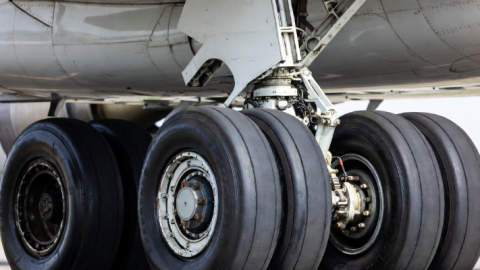The landing gear and tyres of a commercial aircraft.