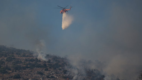 Two helicopters collide outside Athens as Greece battles to control wildfires