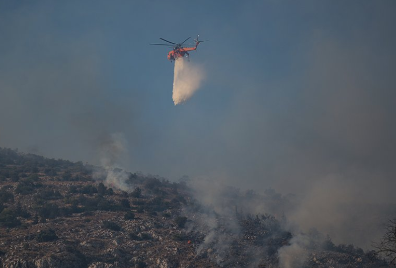 Two helicopters collide outside Athens as Greece battles to control wildfires