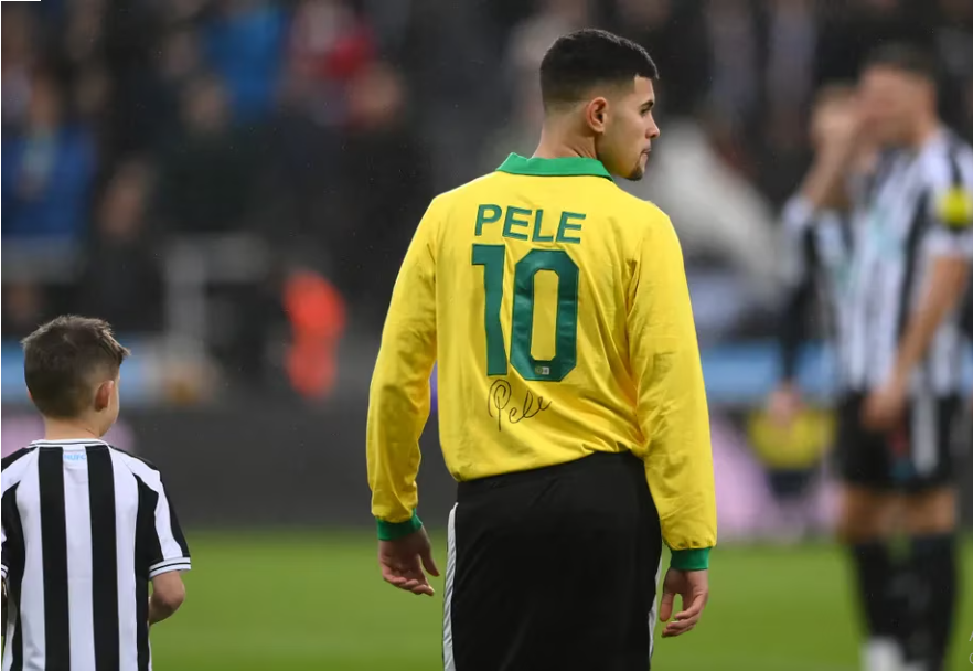 Bruno Guimaraes donning the late Brazilian legend Pele shirt. PHOTO/https://www.arsenal.com