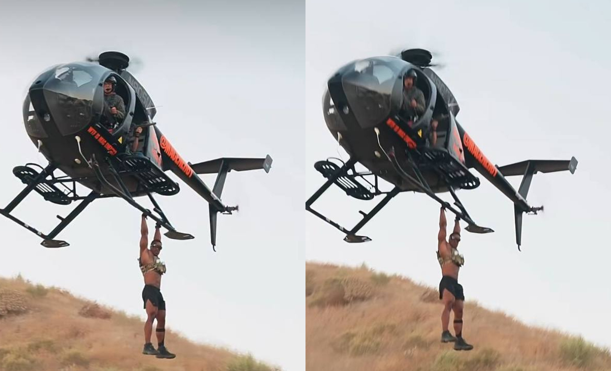 Ashton Hall risks it all to hang from a speeding helicopter in new extreme fitness stunt