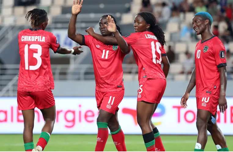 Malawi players celebrate on of their goals against Algeria. PHOTO/https://www.cafonline.com