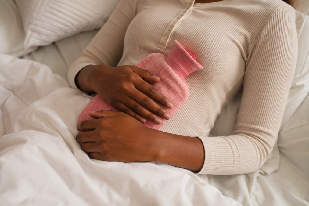 A woman experiencing severe period pains.