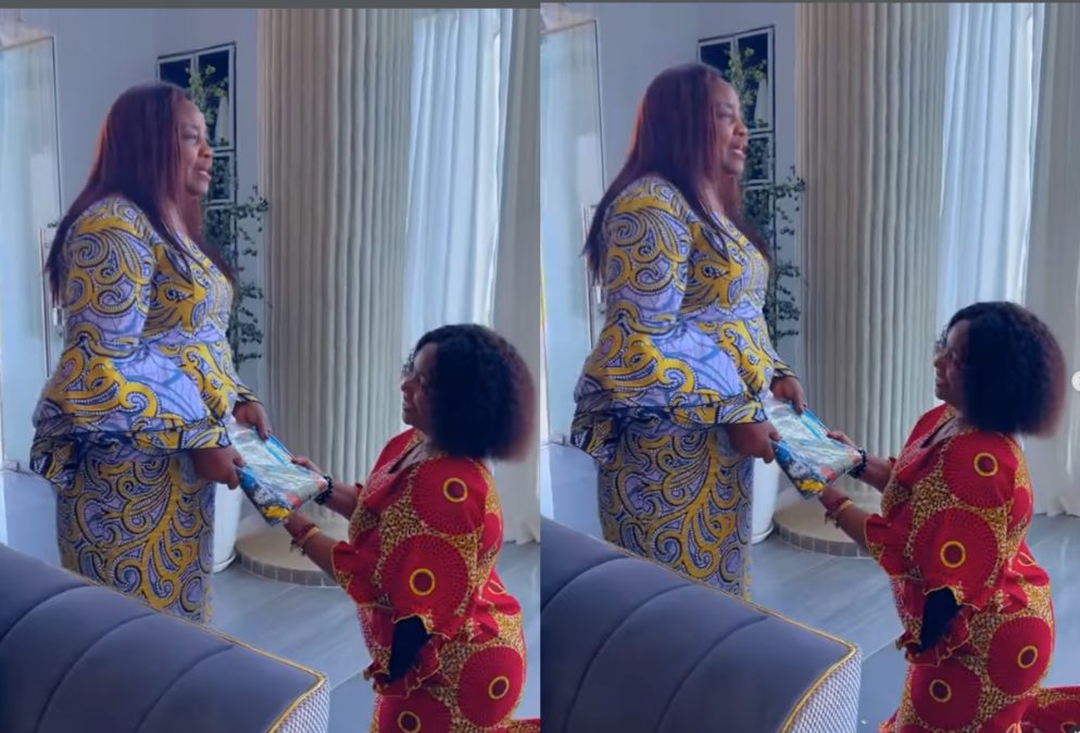 Christina Shusho kneeling while gifting Mama Ida. PHOTOS/Screengrabs by K24 Digital from a video shared by @christinashusho/Instagram